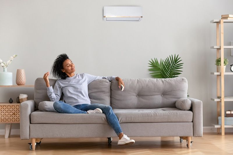 Image of someone sitting on couch. What Accessories Can Help With My Indoor Air Quality?